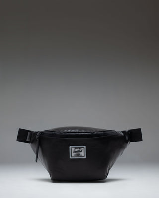 Herschel Supply Co. Pop Quiz Hip Pack in black shown from the front with a white logo patch.