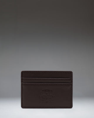 Brown leather Herschel Supply Co. Charlie Cardholder featuring multiple card slots and the classic woven logo label.