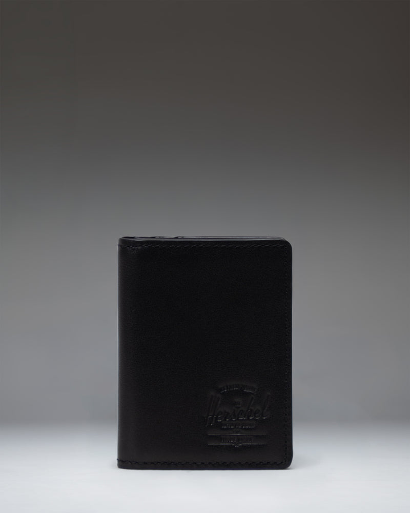 Black Herschel Supply Co. Gordon Wallet Leather shown open, displaying internal card slots and bill compartment.