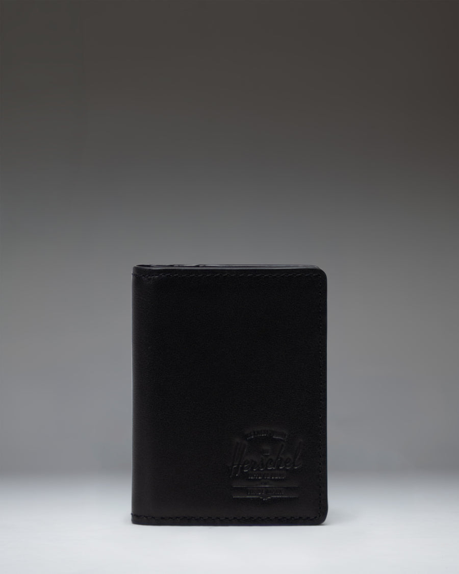 Black Herschel Supply Co. Gordon Wallet Leather shown open, displaying internal card slots and bill compartment.