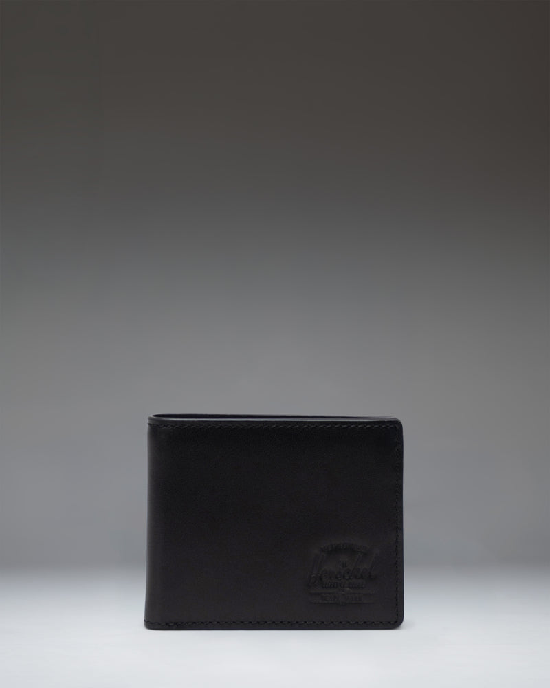 Herschel Supply Co Hank Wallet Leather in Black, shown opened to display internal card slots and a mesh ID window.