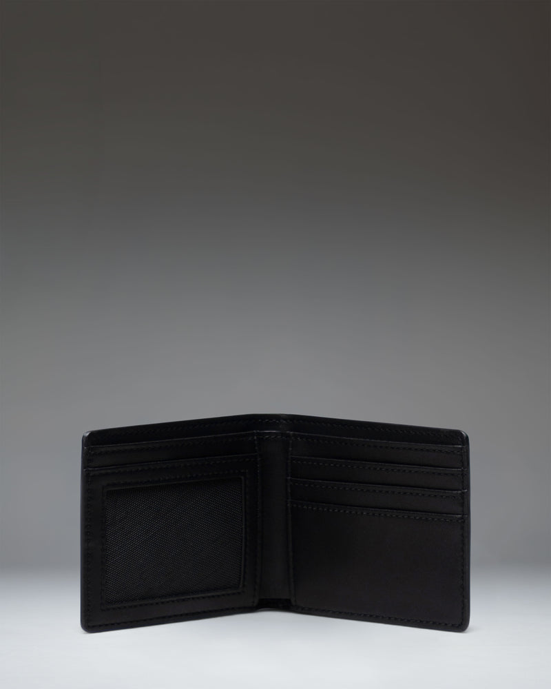 Herschel Supply Co. Hank Wallet Leather in Black, shown open to reveal interior card slots and a mesh ID window.