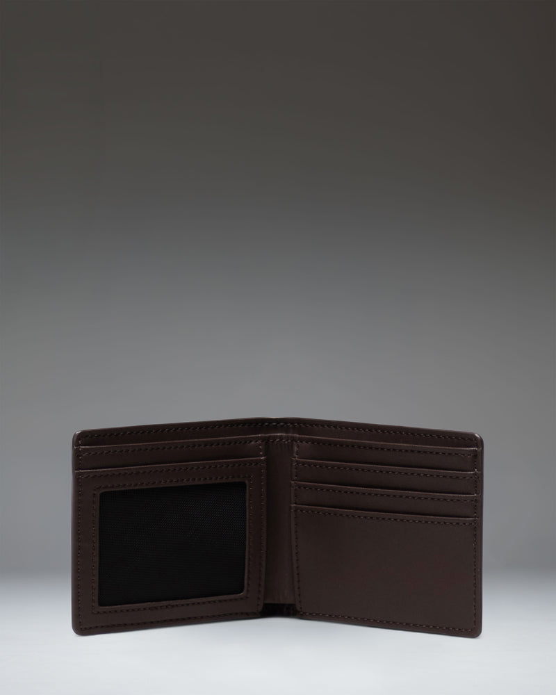 Herschel Supply Co Hank Wallet Leather in brown, featuring a classic bi-fold design with internal card slots and a coin pocket.