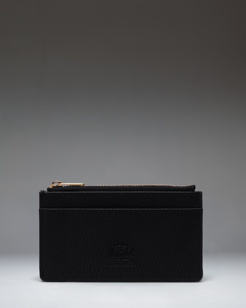 Herschel Supply Co. Oscar Large Cardholder in black vegan leather, shown from a front perspective detailing the card slots and sleek design.