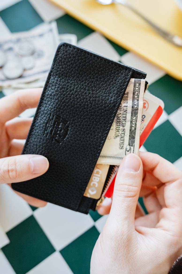 Herschel Oscar Large Cardholder in multiple colors showing a variety of different style wallets lined up in rows.