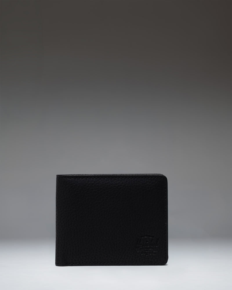 Herschel Supply Co. Roy Wallet Vegan Leather in black, showing the classic bi-fold design.