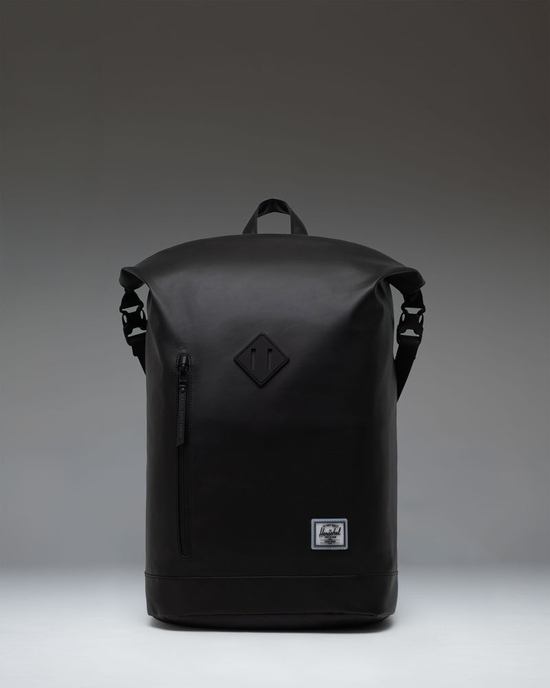 Black Herschel Supply Co. Roll Top Backpack shown from the front, highlighting its roll-top closure and clean, minimalist design.