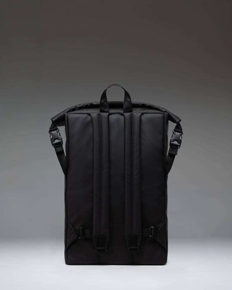 Herschel Supply Co. Roll Top Backpack in solid black, showcasing a clean, modern design with a rolled top closure and buckle fastening.