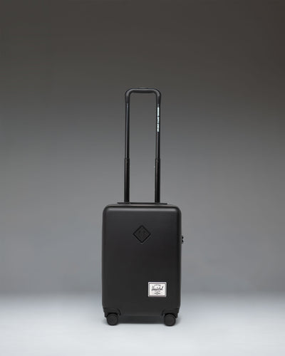 Herschel Supply Co. Heritage Hardshell Carry On Luggage in black.