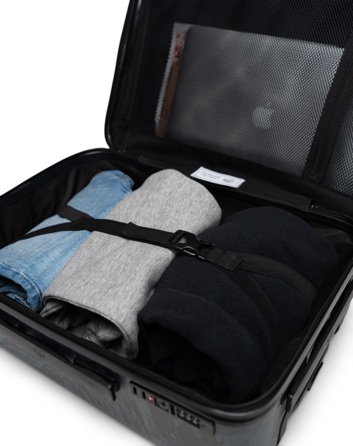 Size chart for Herschel Heritage Hardshell Luggage showing dimensions and volumes for Carry On (35L), Large Carry On (43L), Medium (67L), and Large (95L) sizes.