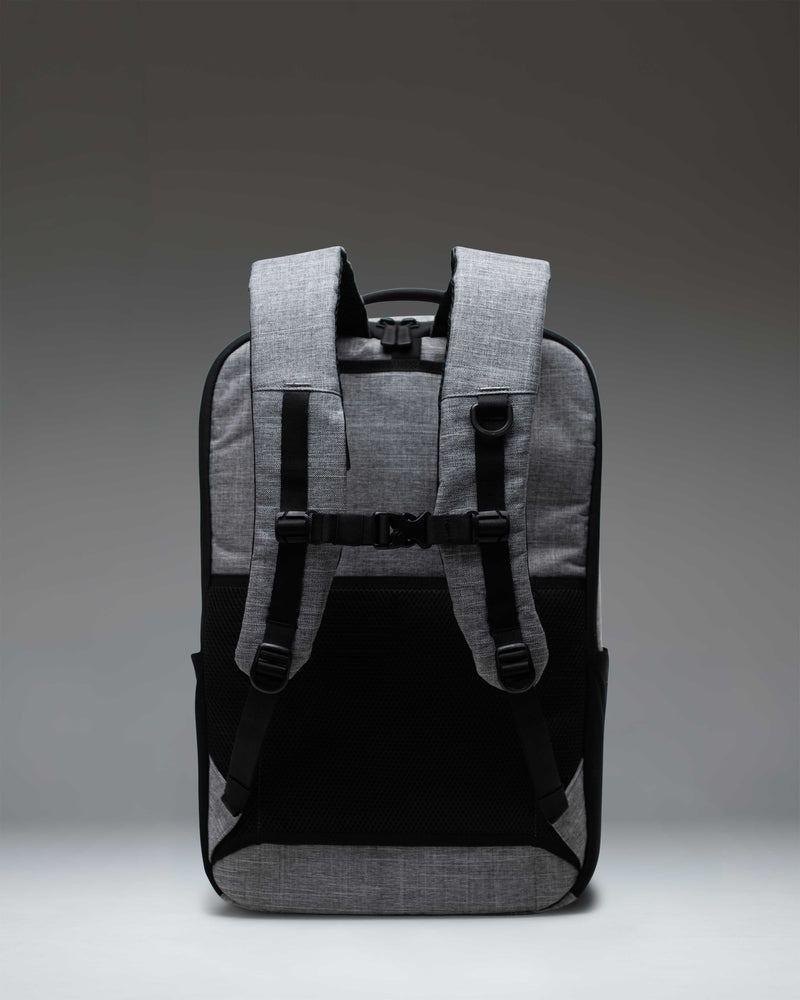 Herschel Supply Co. Kaslo Backpack Tech in Raven Crosshatch grey, showing a detailed close-up of the front zipper pocket and durable material.