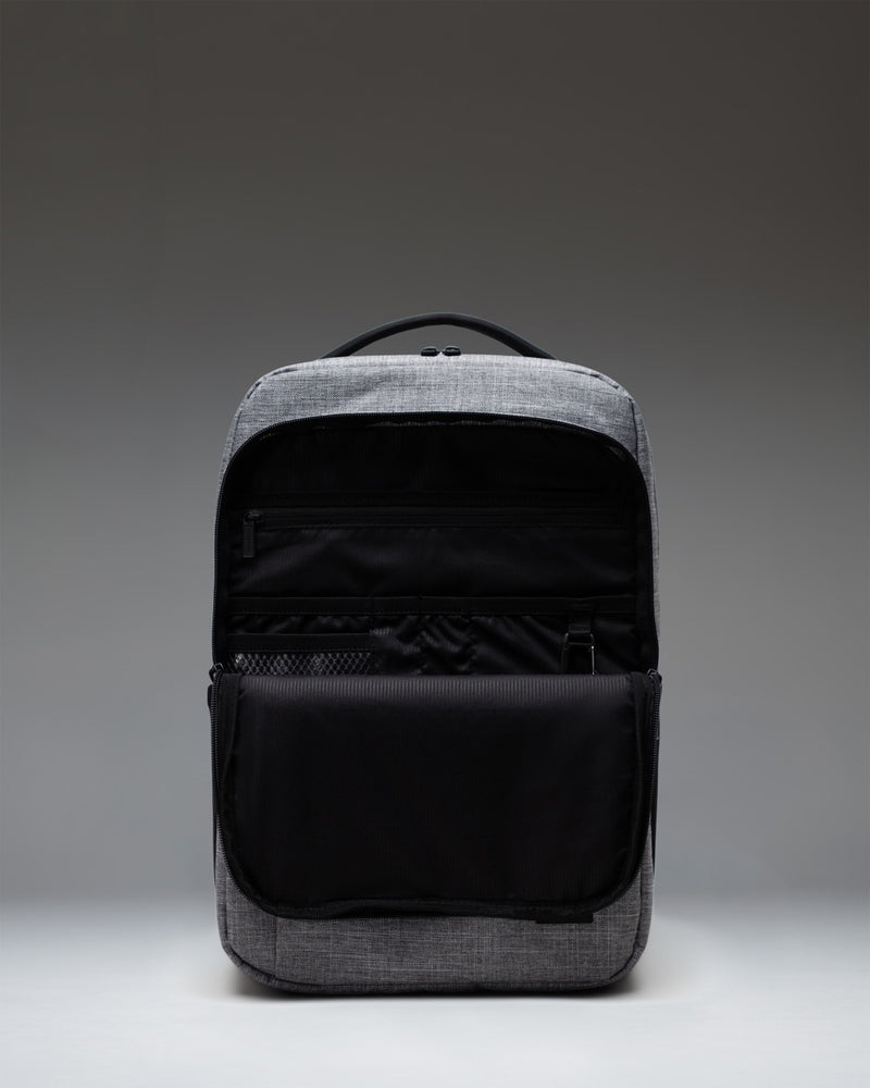 Herschel Supply Co. Kaslo Daypack Tech in Raven Crosshatch grey heathered fabric, showing the backpack's functional exterior design.