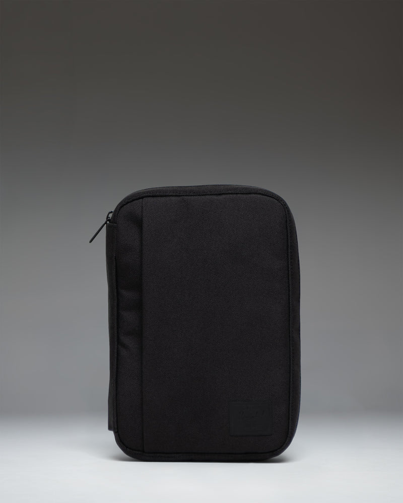Black Herschel Supply Co. Burrard Organizer Tech pouch, front view showing the clean exterior design and classic woven label.