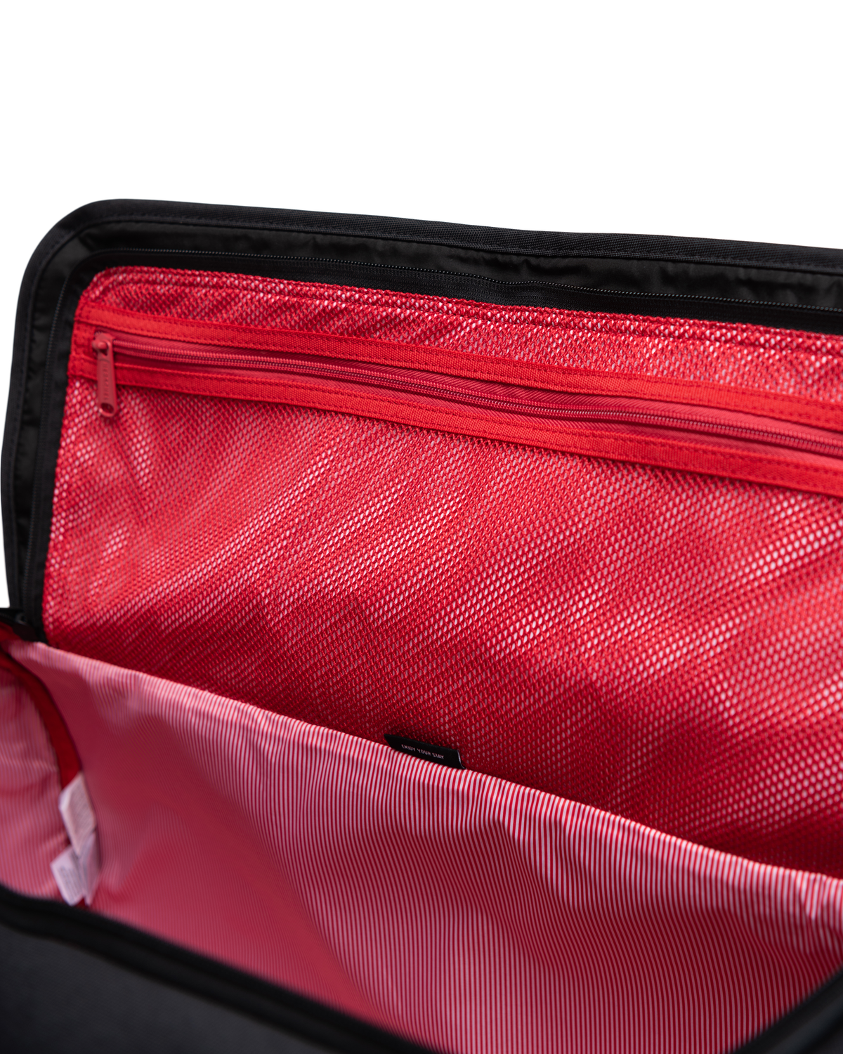 Herschel Supply Co. Heritage Duffle bag showing its classic design, signature diamond detail, and convenient U-shaped opening.