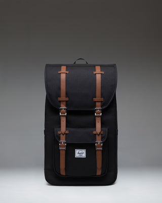 Herschel Supply Co. Little America Backpack in black, featuring a classic mountaineering style with dual rubber straps and a front pocket.