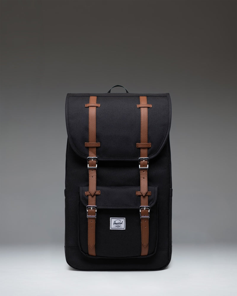 Herschel Supply Co. Little America Backpack in black, featuring a classic mountaineering style with dual rubber straps and a front pocket.
