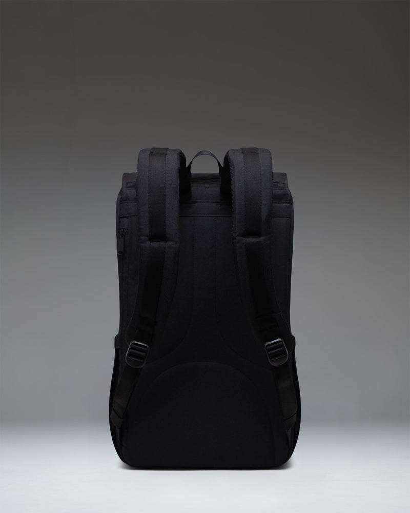 Herschel Little America Backpack in black, featuring a classic mountaineering design with dual magnetic strap closures and front pocket.