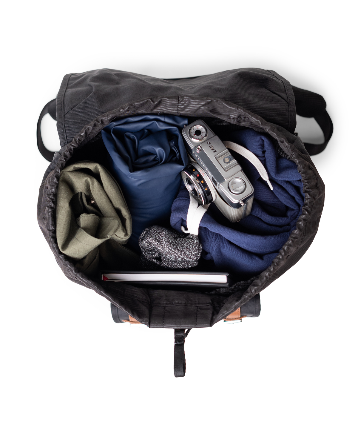 Close-up of a Herschel Little America Backpack highlighting its durable design, magnetic strap closures, and front storage pocket.