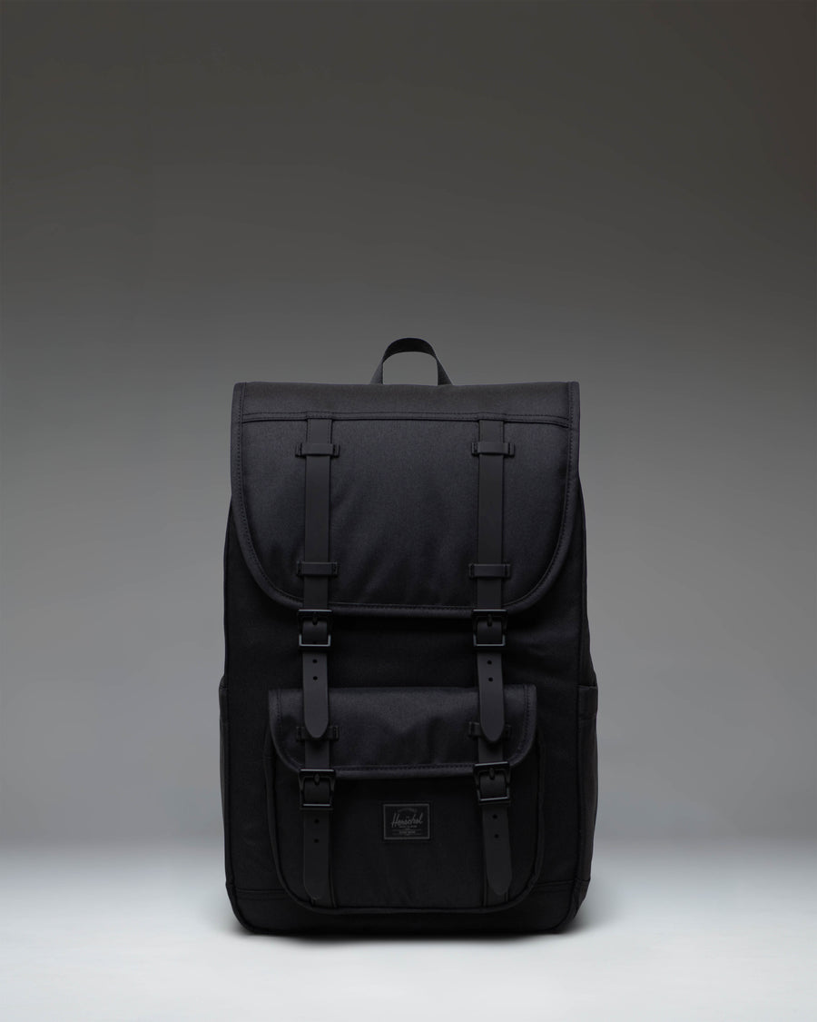 Herschel Little America Mid Backpack in Black Tonal, showing the front view with signature rubber straps and woven label.