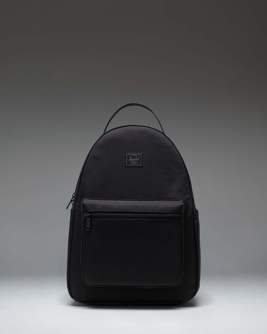 Herschel Nova Backpack in Black Tonal, showing the front view with dual top carrying handles and a front storage pocket.