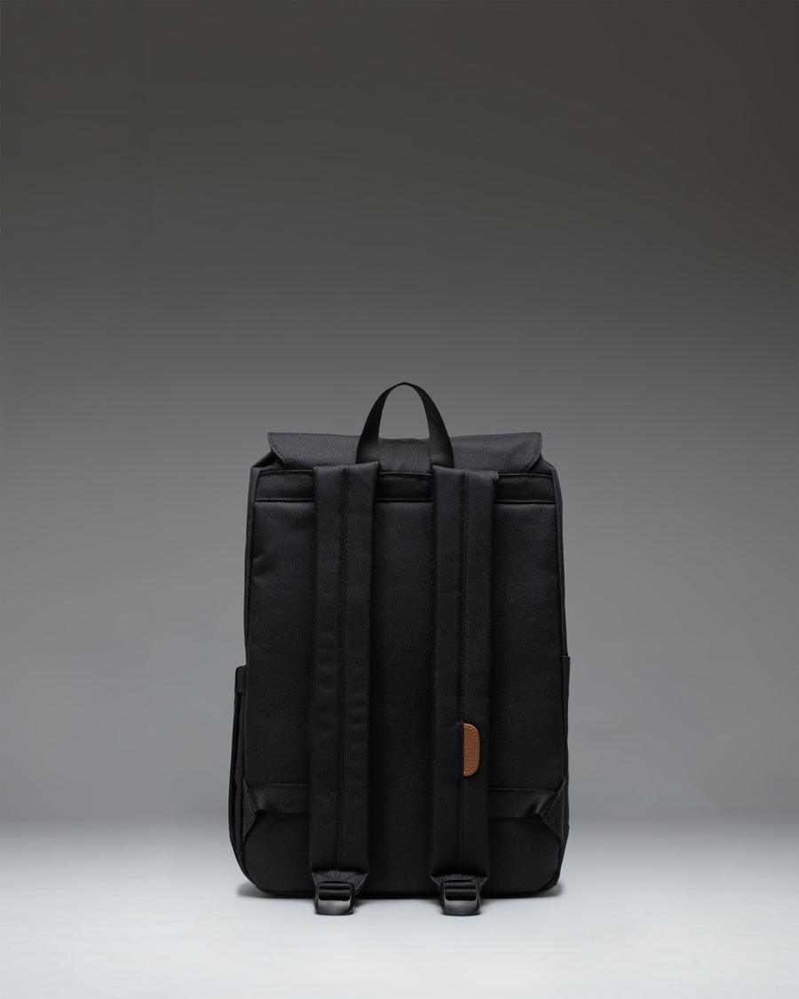Herschel Retreat Small Backpack in black, featuring a classic silhouette, drawcord closure, and magnet-fastened straps with metal buckles.
