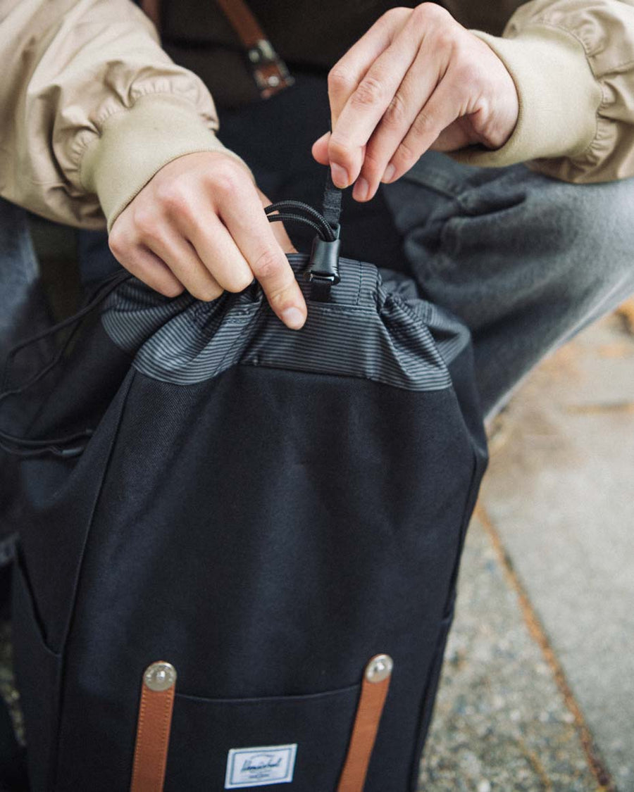 Herschel Retreat Small Backpack in All Colors, showing a multi-colored array of 17L backpacks with front straps and drawcord closures.
