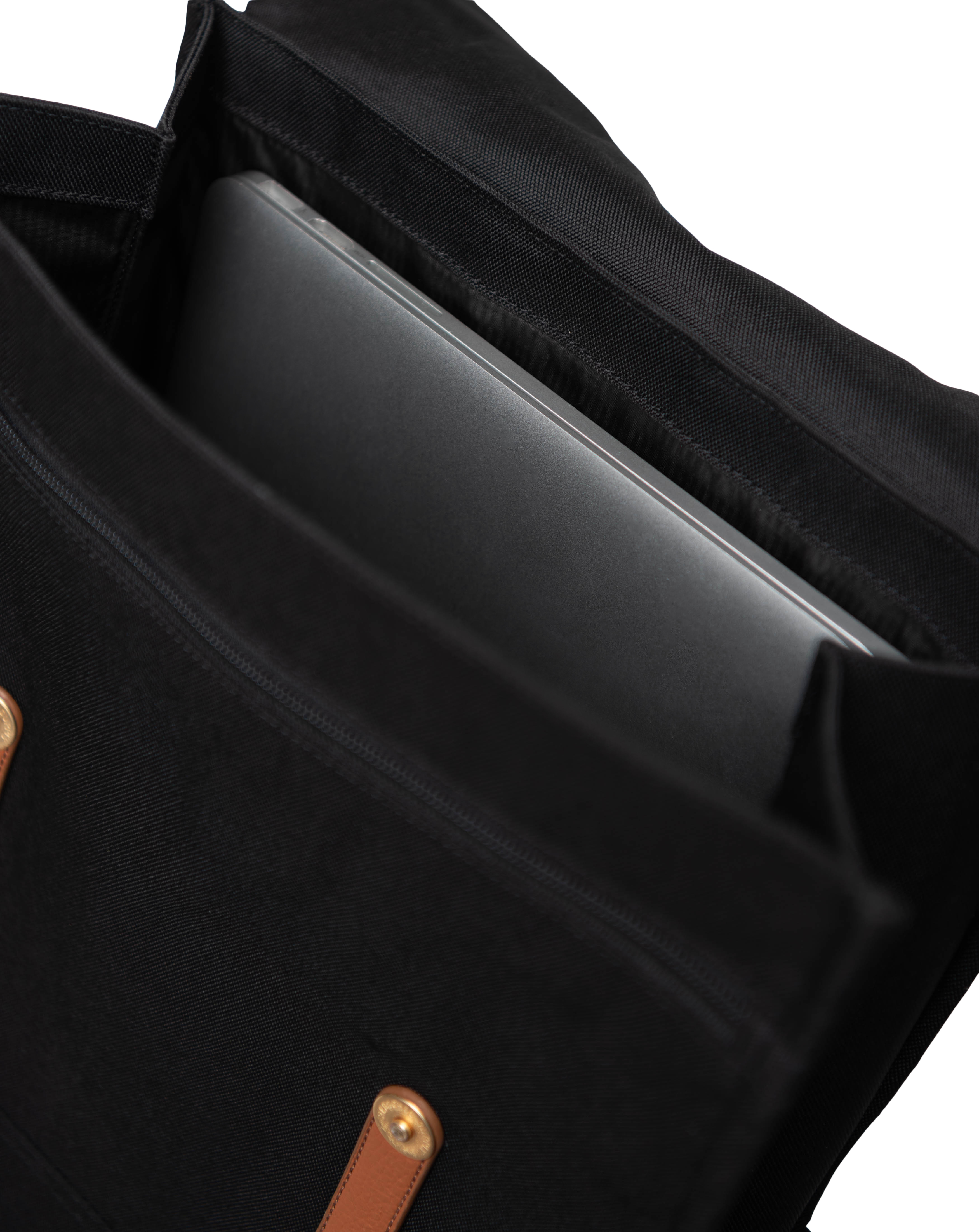 A minimalist Herschel Survey Backpack shown on a white background highlighting its clean, square design, magnetic strap closures, and front flap.