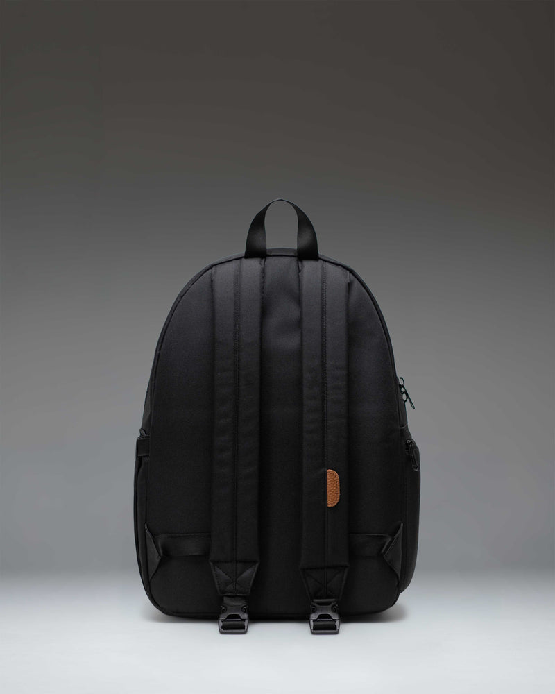 Herschel Supply Co. Settlement Backpack Diaper Bag in black, featuring a classic design with exposed zippers and a front pocket.
