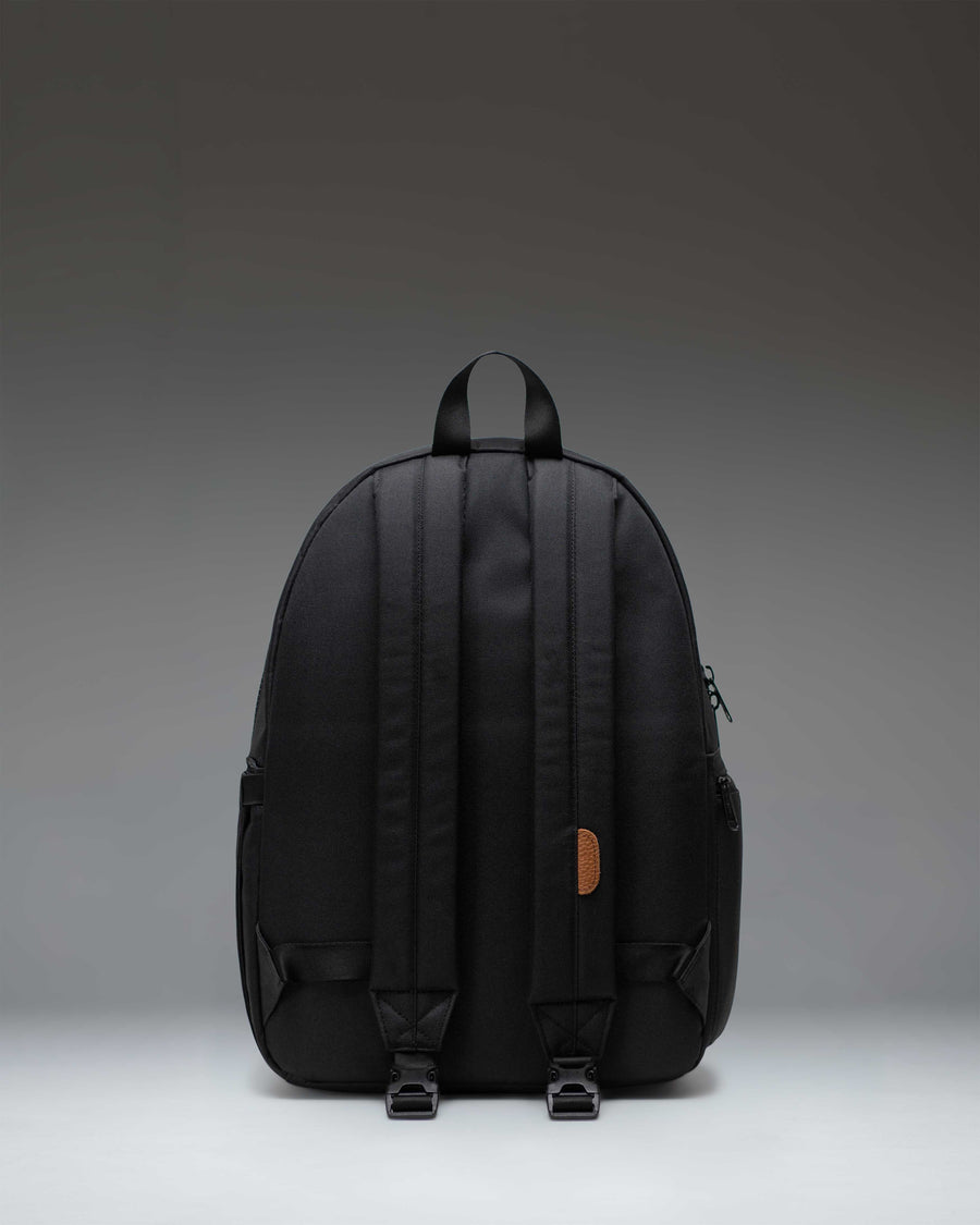 Herschel Supply Co. Settlement Backpack Diaper Bag in black, featuring a classic design with exposed zippers and a front pocket.