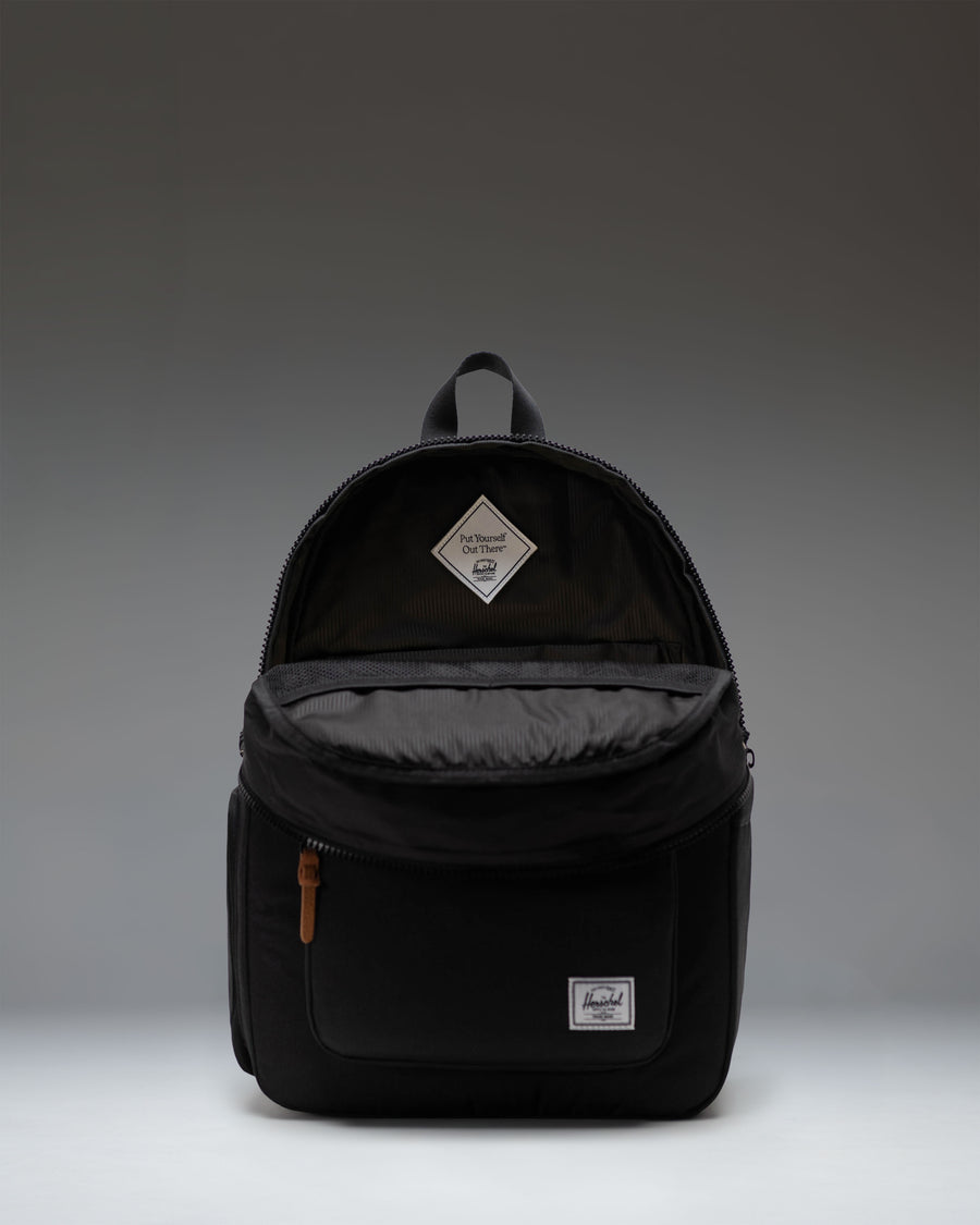 Herschel Supply Co. Settlement Backpack Diaper Bag in black, featuring a classic design with front pocket and exposed zippers.