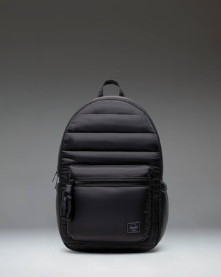 Herschel Supply Co. Settlement Backpack in black, showing the classic design with a front pocket and exposed zippers.