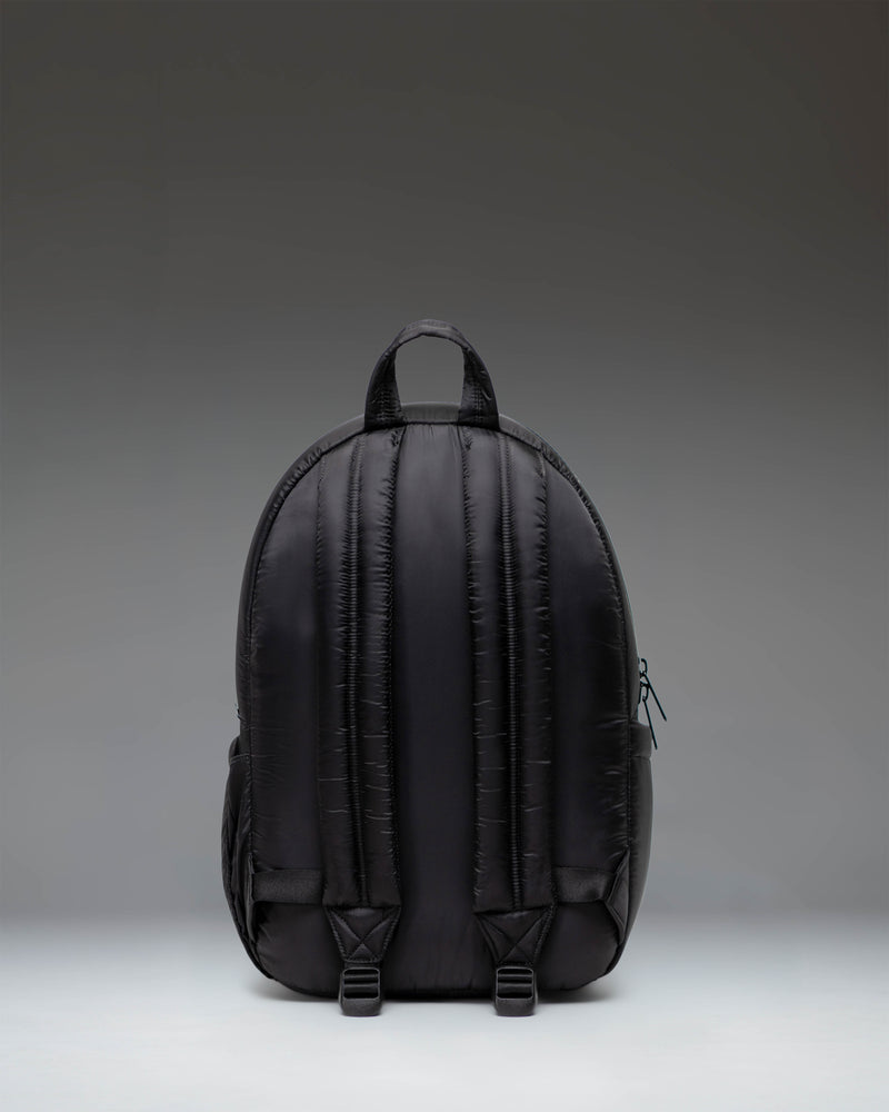 Classic Herschel Supply Co. Settlement Backpack in solid black, featuring a front storage pocket and signature woven label.