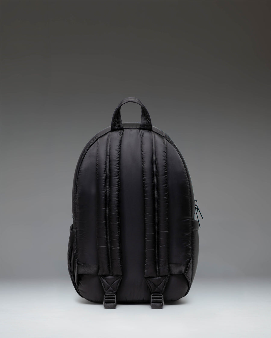 Classic Herschel Supply Co. Settlement Backpack in solid black, featuring a front storage pocket and signature woven label.