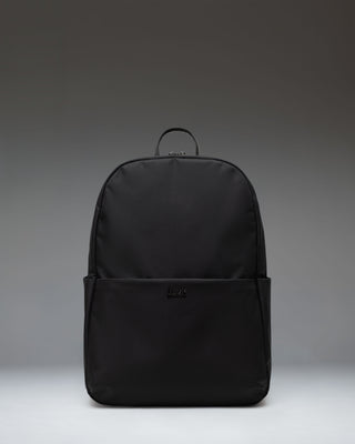 Herschel Supply Co. Beatrix Backpack in black, showing the front view with classic straps, zippers, and signature logo patch.