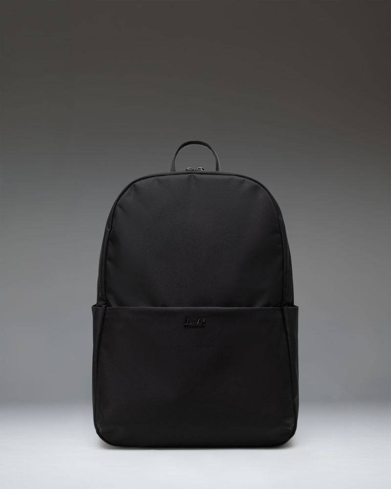 Herschel Supply Co. Beatrix Backpack in black, showing the front view with classic straps, zippers, and signature logo patch.