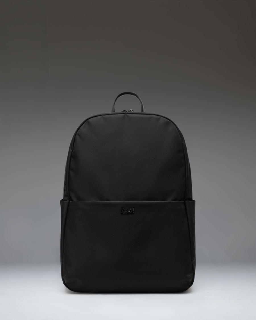 Herschel Supply Co. Beatrix Backpack in black, showing the front view with classic straps, zippers, and signature logo patch.