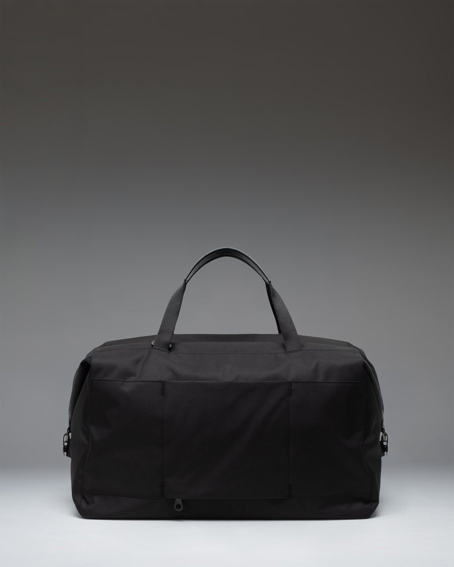 Herschel Supply Co. Maia Weekender duffel bag in black, featuring a spacious design and durable fabric ideal for travel and weekend getaways.