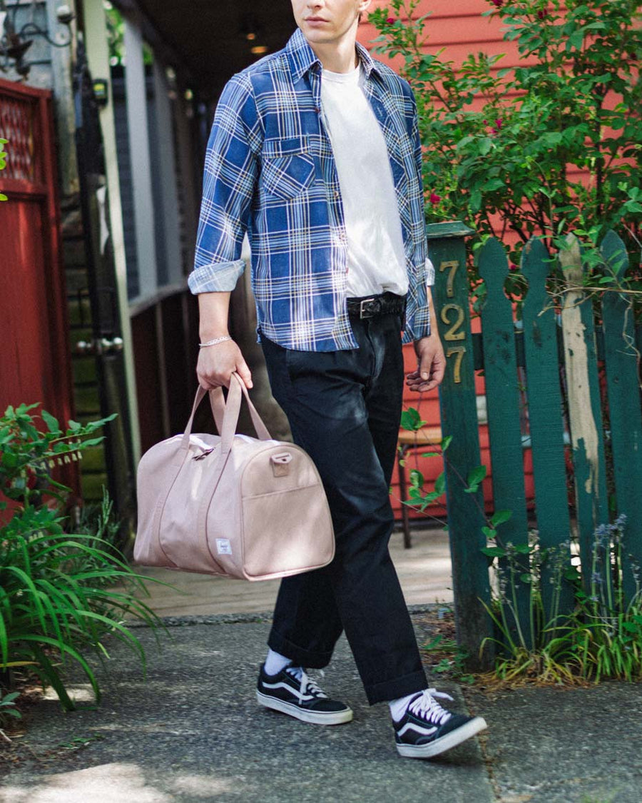 A multi-colored grid pattern featuring all available color swatches for the Herschel Novel Carry-On Duffle.