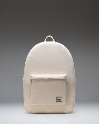 Herschel Supply Co. Pacific Daypack in Natural, showing a clean, minimalistic design with adjustable shoulder straps and a front zippered pocket.