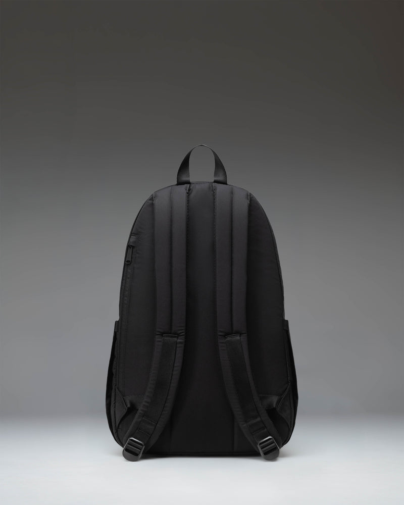 Black Herschel Seymour Backpack featuring dual water bottle pockets, a front zippered sleeve, and classic woven label.