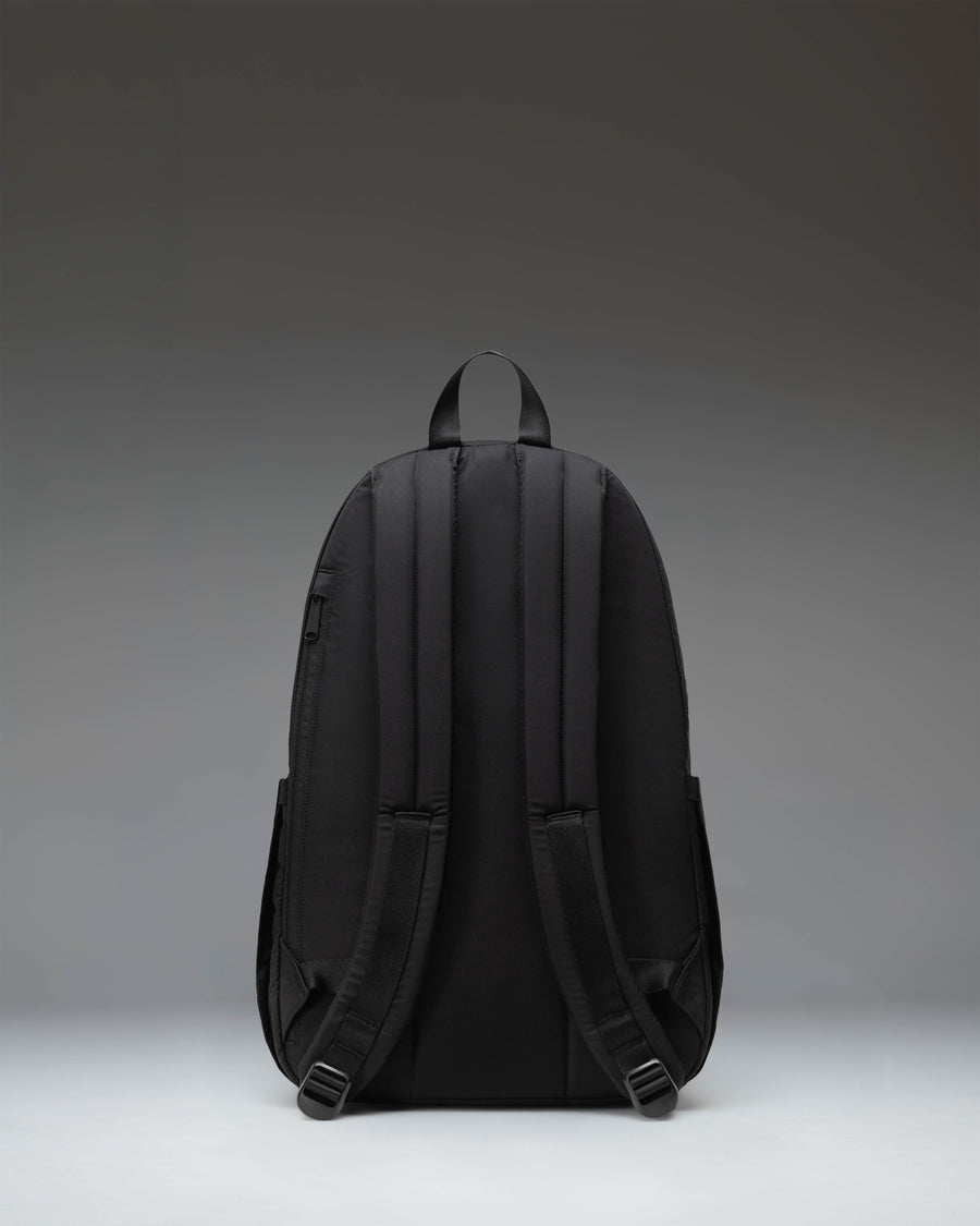 Black Herschel Seymour Backpack featuring dual water bottle pockets, a front zippered sleeve, and classic woven label.