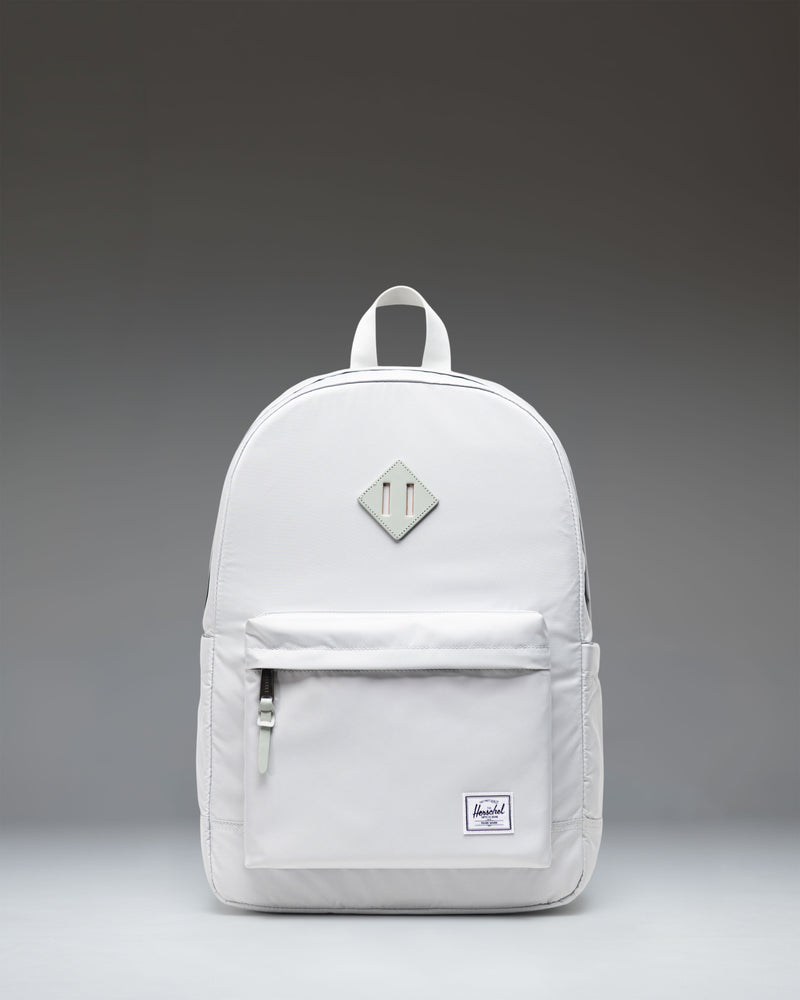 Herschel Heritage Backpack in Metal gray featuring a front storage pocket and classic woven label.