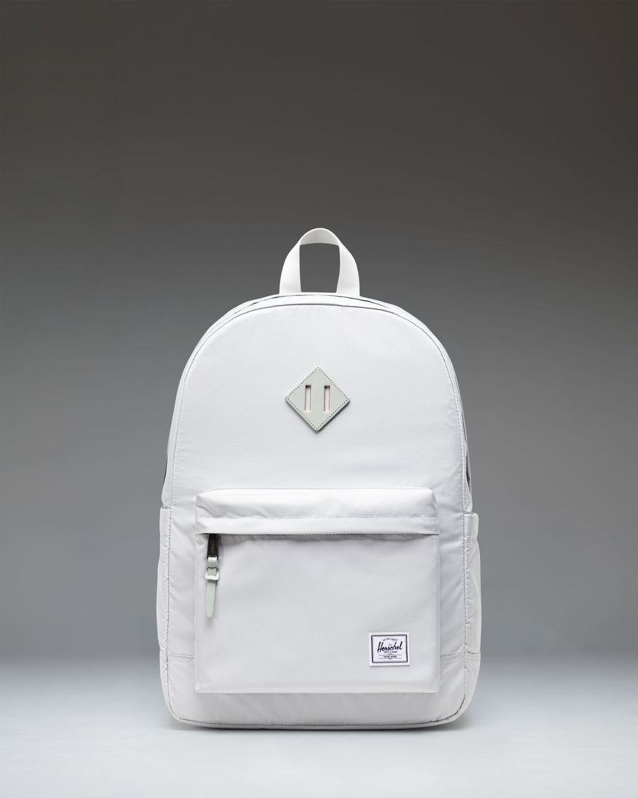 Herschel Heritage Backpack in Metal gray featuring a front storage pocket and classic woven label.