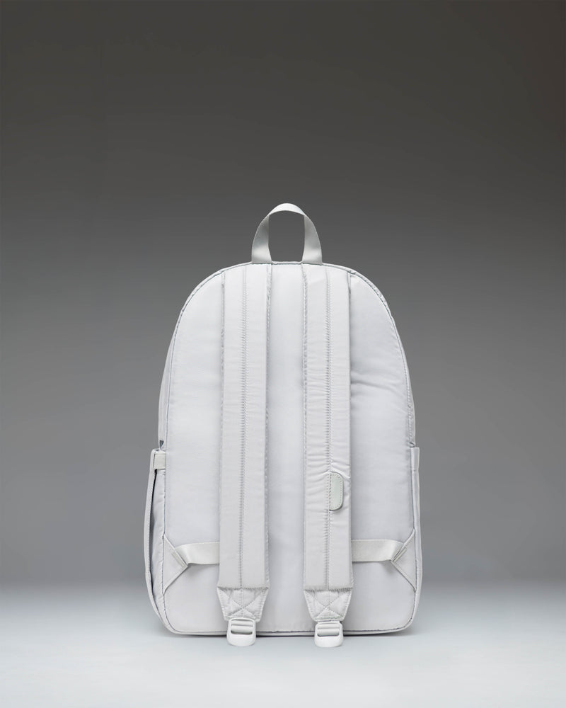 Herschel Heritage Backpack in Metal color shown from the side, emphasizing the silhouette, padded shoulder straps, and water bottle pocket.