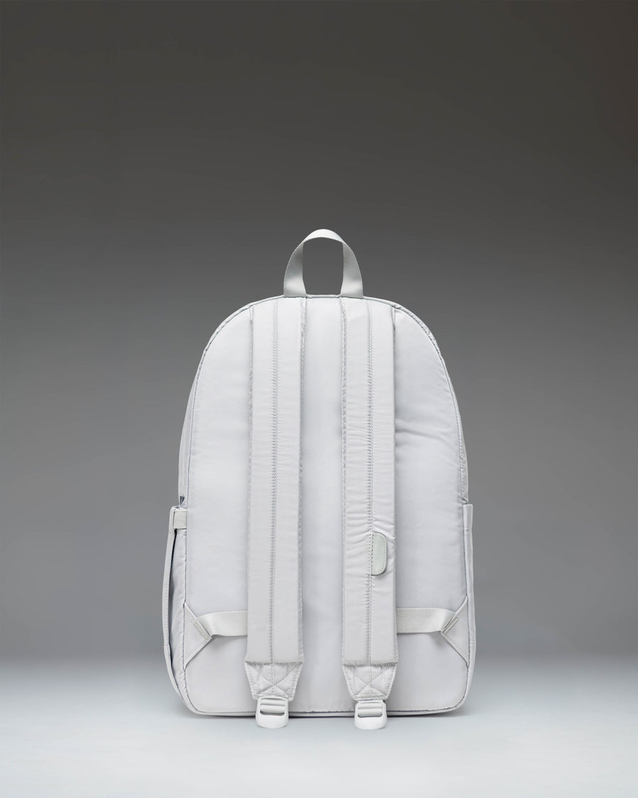 Herschel Heritage Backpack in Metal color shown from the side, emphasizing the silhouette, padded shoulder straps, and water bottle pocket.