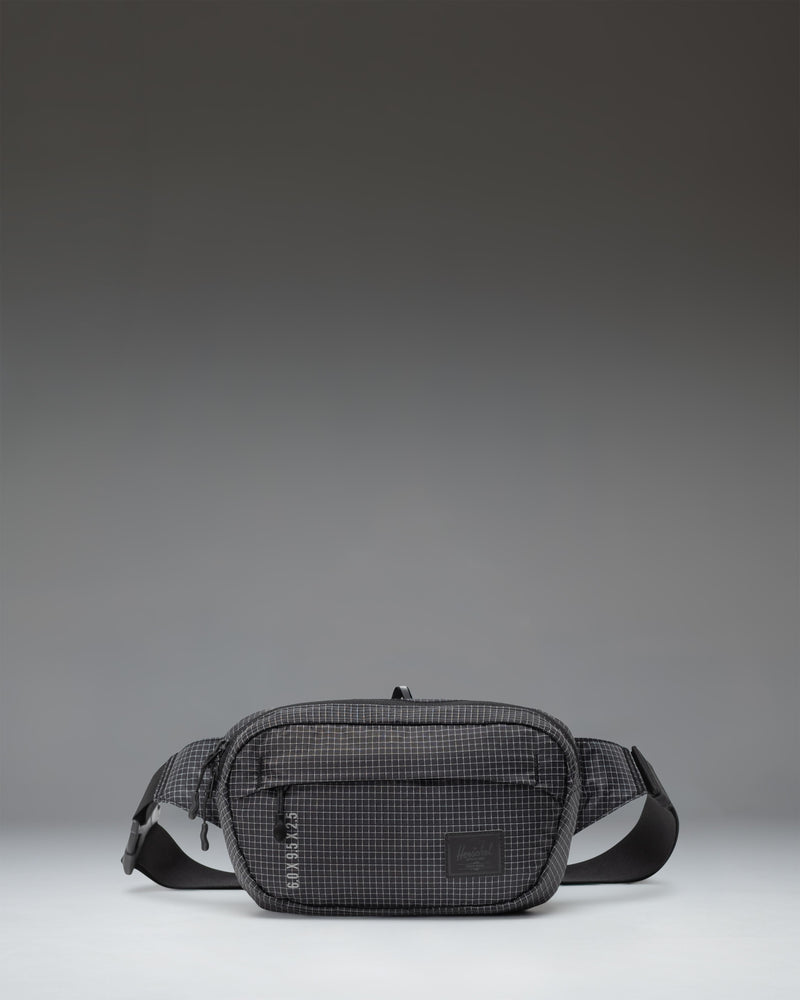 Herschel Supply Co Ultralight Hip Pack 2 L in Black shown from the front highlighting its lightweight design and adjustable strap.