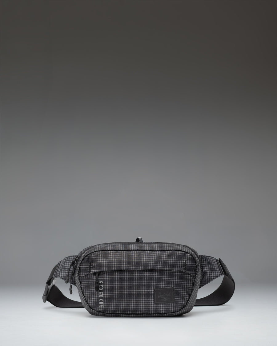 Herschel Supply Co Ultralight Hip Pack 2 L in Black shown from the front highlighting its lightweight design and adjustable strap.