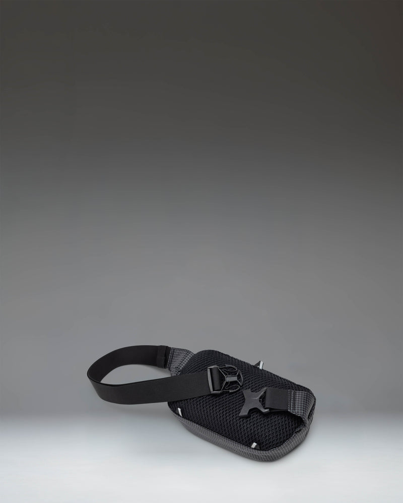 Herschel Supply Co. Ultralight Hip Pack 2L in Black, featuring a lightweight design with adjustable strap and zippered compartment.