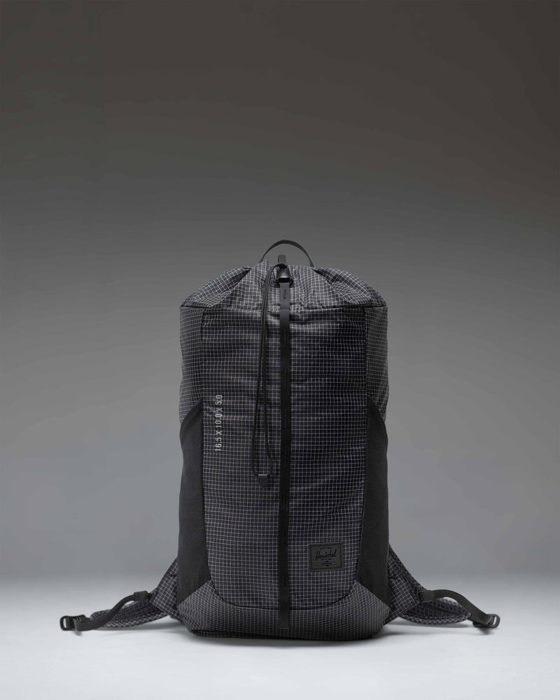 Black Herschel Supply Co Ultralight Cinch Daypack 14 L backpack shown from the front with a drawstring closure and a front zippered pocket.
