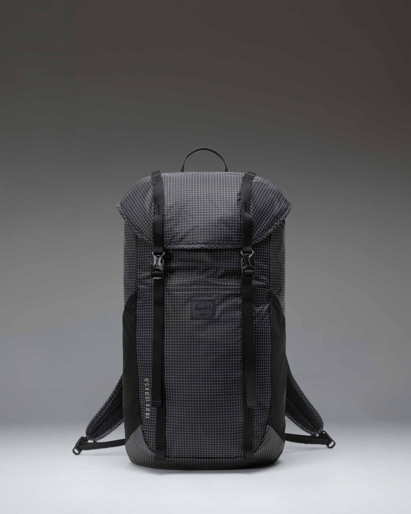 Black Herschel Supply Co Ultralight Backpack 22 L shown from the front with adjustable shoulder straps and top handle.